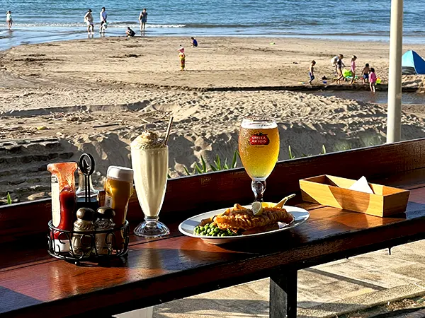 Fresh seafood platter and a glass of wine at a Mossel Bay restaurant